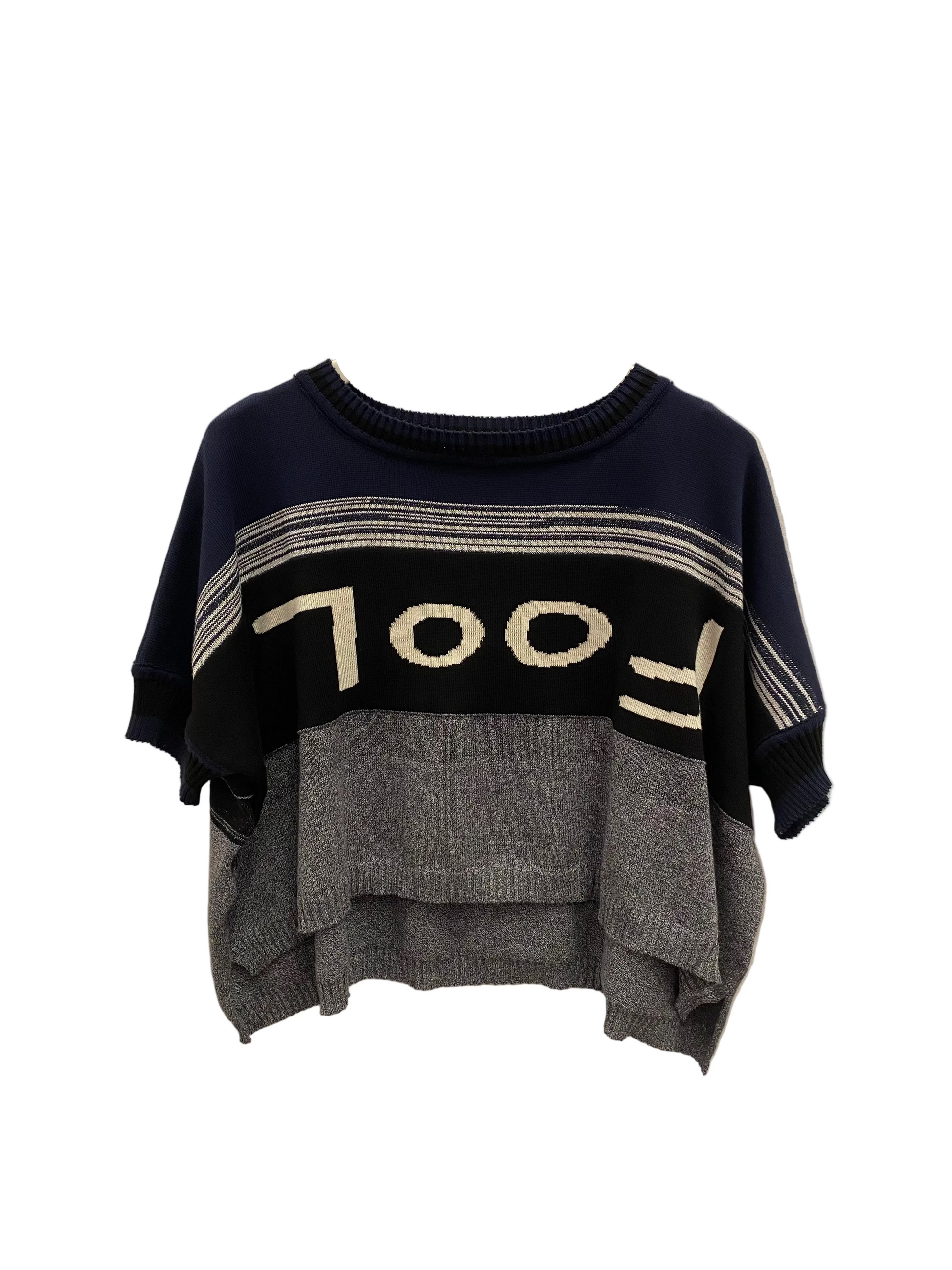 Navy, black and grey marled stripe body with upside down FOOL font on front of knit top.