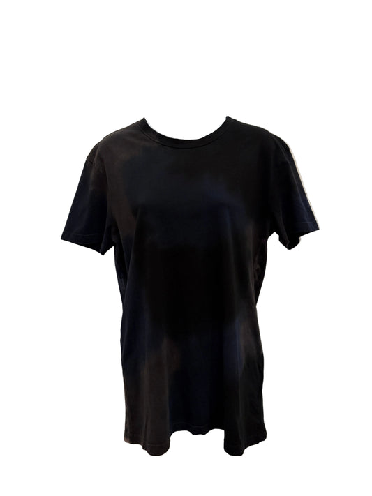 A black hand painted short-sleeve crewneck t-shirt displayed on a  mannequin torso against a  white wall.
