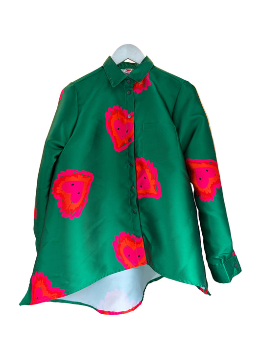 A green long-sleeve button-up shirt with a vibrant pink and red abstract fire heart pattern